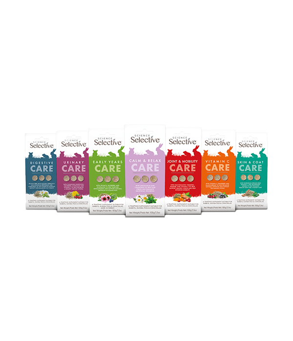 Science Selective Care Supplements range for small pets, seven resealable boxes standing in a row. From left to right: Digestive Care (blue), Urinary Care (purple), Early Years Care (green), Calm & Relax Care (lavender), Joint & Mobility Care (red), Vitamin C Care (orange), and Skin & Coat Care (teal). Each pack shows rabbit/guinea pig silhouettes at the top, gold benefit badges, and small ingredient imagery at the bottom.